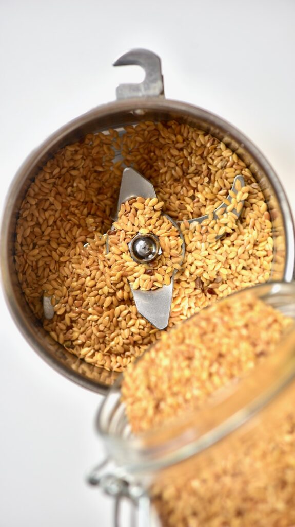 https://www.alphafoodie.com/wp-content/uploads/2020/06/pouring-golden-Flaxseed-into-a-spice-grinder-575x1024.jpeg