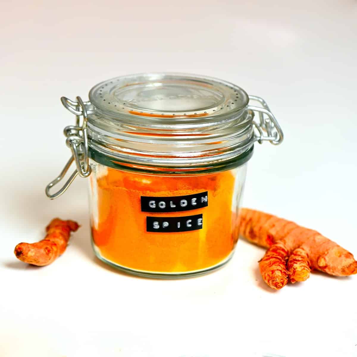 https://www.alphafoodie.com/wp-content/uploads/2020/07/jar-of-golden-spice-mix-with-turmeric-roots-on-the-side.jpeg