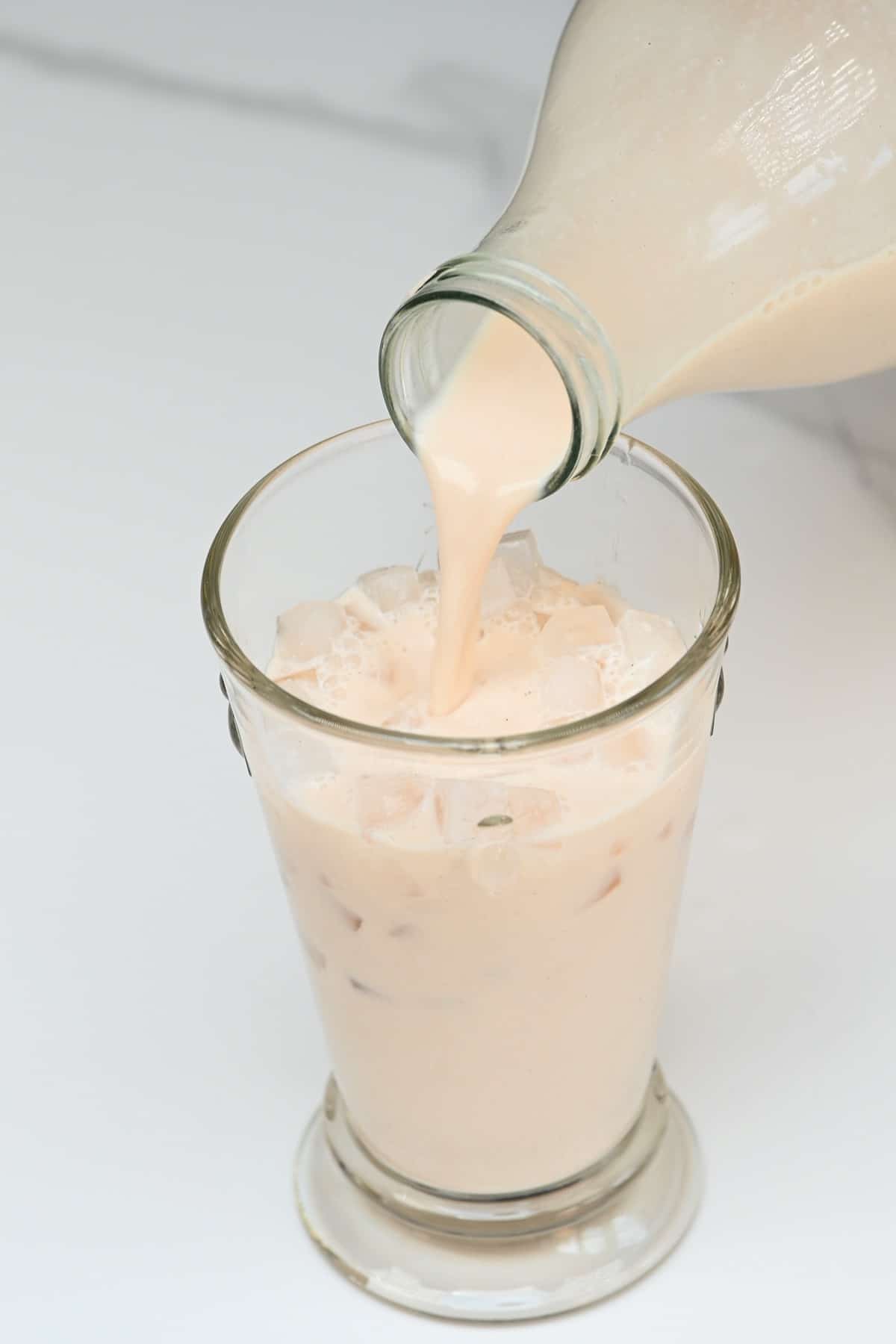 Pouring horchata in a glass