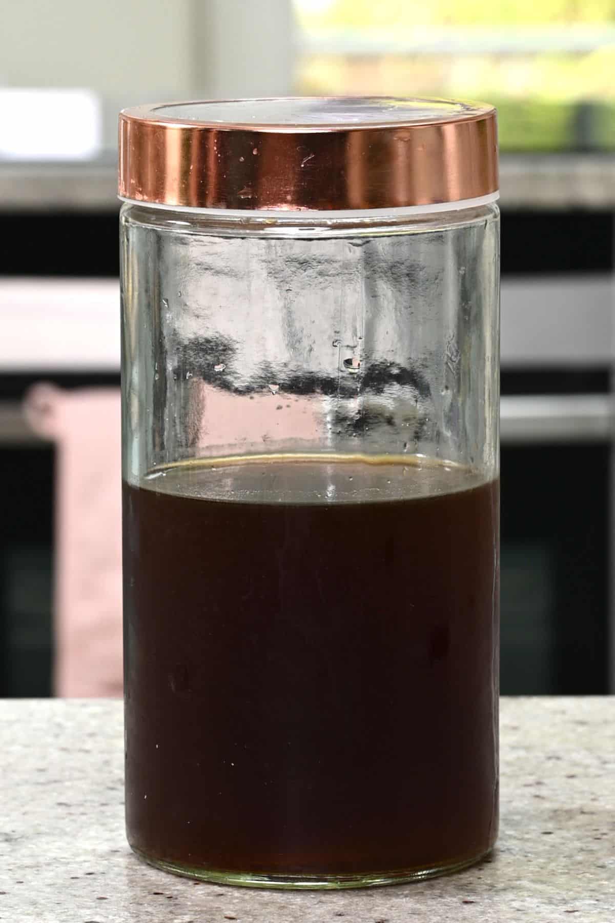 https://www.alphafoodie.com/wp-content/uploads/2022/07/Cold-Brew-Coffee-A-glass-container-with-cold-brew-coffee-concentrate.jpeg