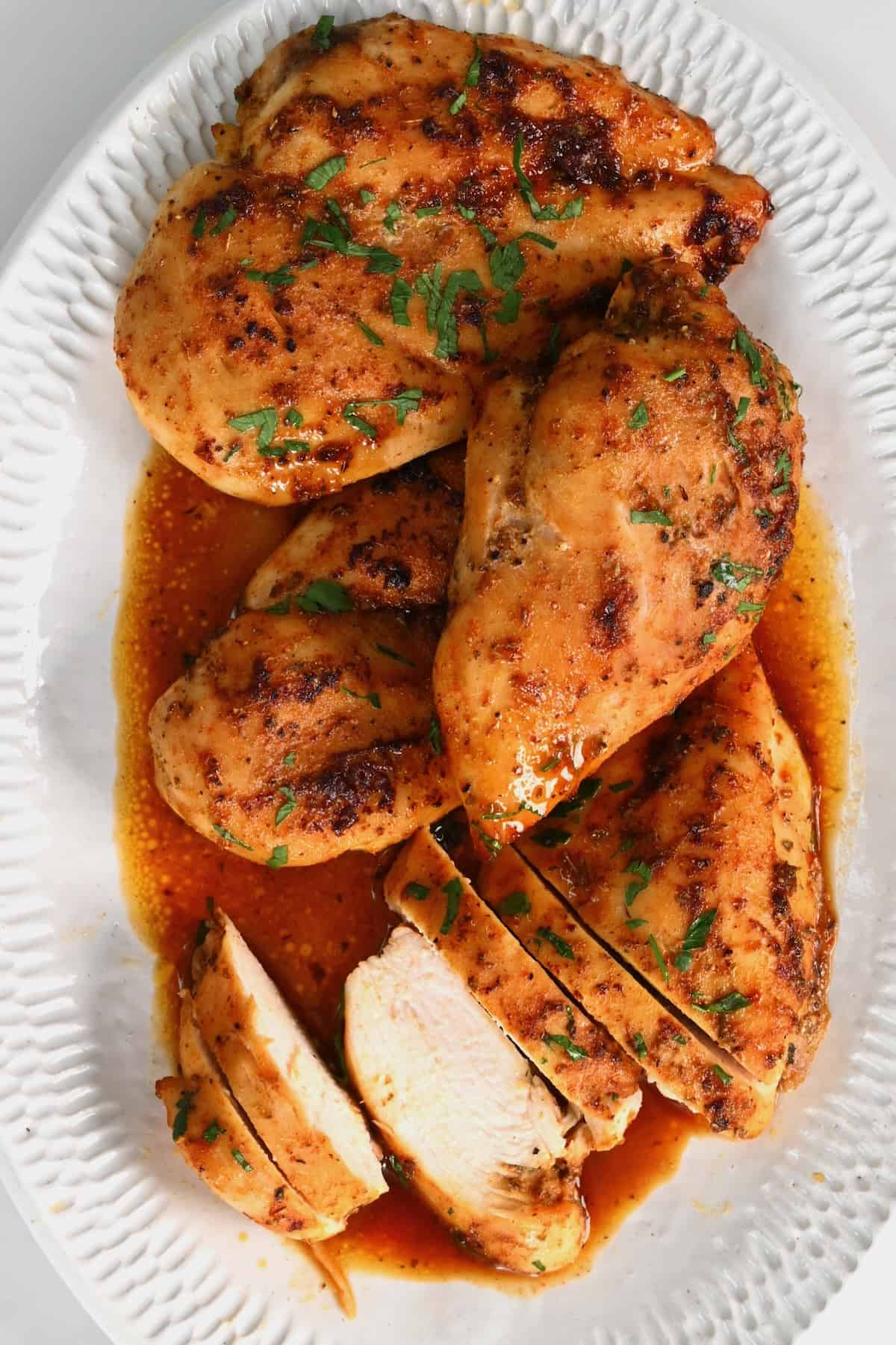 https://www.alphafoodie.com/wp-content/uploads/2022/08/Baked-Chicken-Breast-Baked-chicken-on-a-plate.jpeg